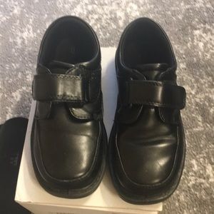 Boys black wide dress shoes.